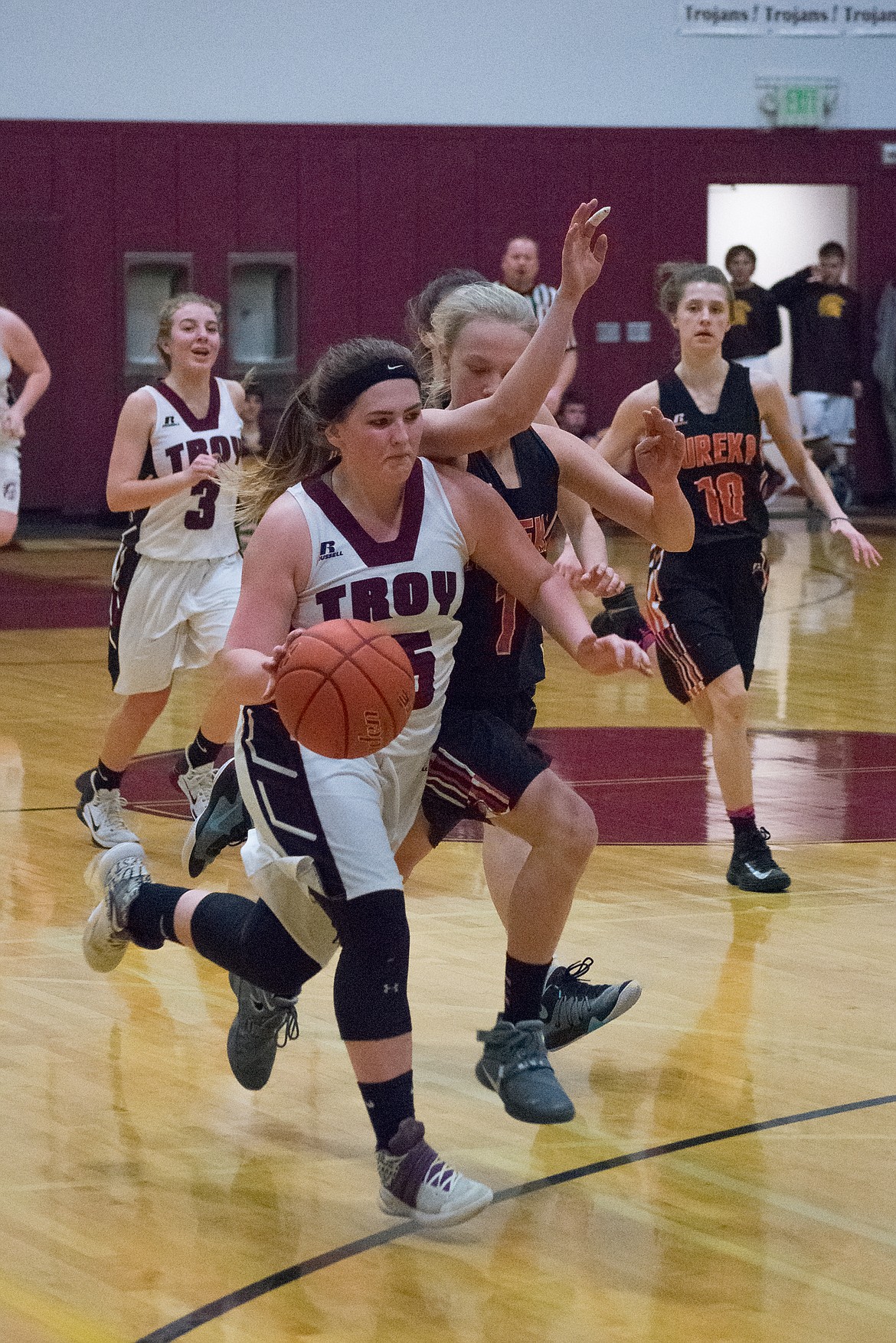 Troy sophomore Kaitlyn Downey cuts past Eureka&#146;s Michael Shea on her way to the basket Friday.(Ben Kibbey/The Western News)