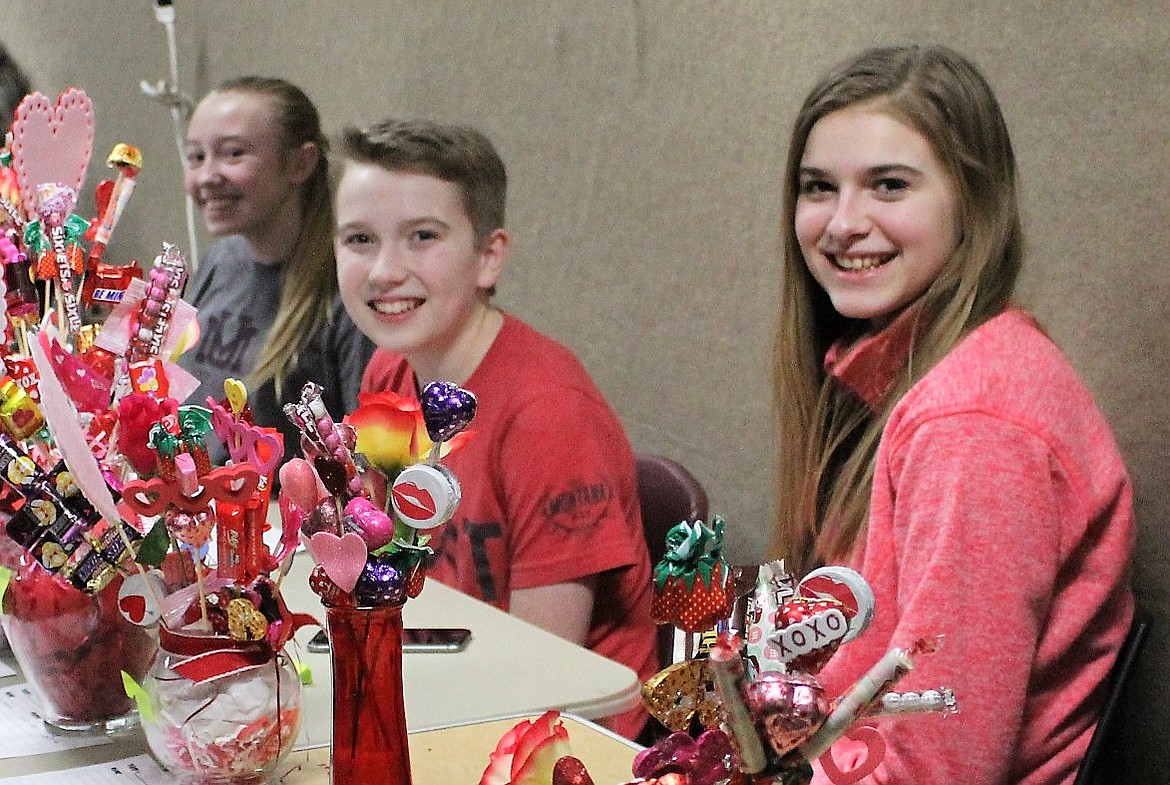 Sweet fund-raiser

St. Regis eighth-graders Karmen Alexander (left), Carter Jasper (middle) and Sunny Shoupe (right) auctioned off candy bouquets during the Senior Night basketball game on Feb. 8. Funds will be used for a class trip to Triple-Play. (Kathleen Woodford/Mineral Independent)