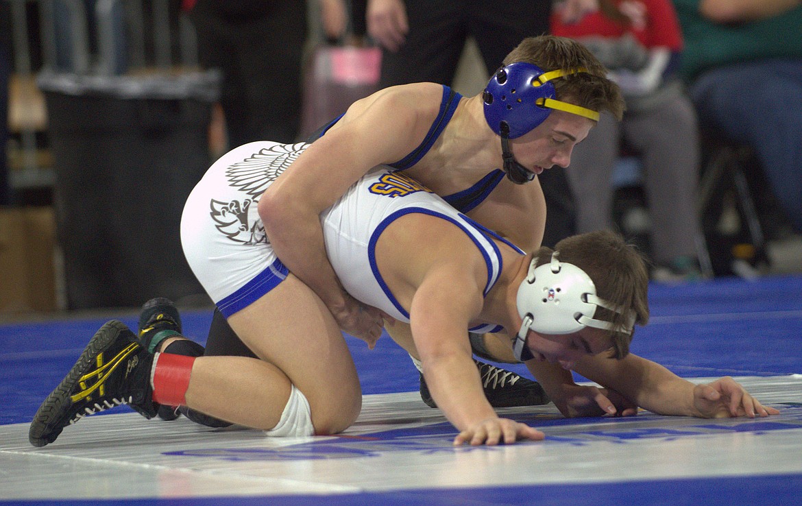 Libby&#146;s Buddy Doolin wrestles Cooper Birdwell of Fergus High School Saturday. Birdwell won by a 7-3 decision, giving Doolin second place overall for the 113-pound class. (Jason Blasco/Lake County Leader)