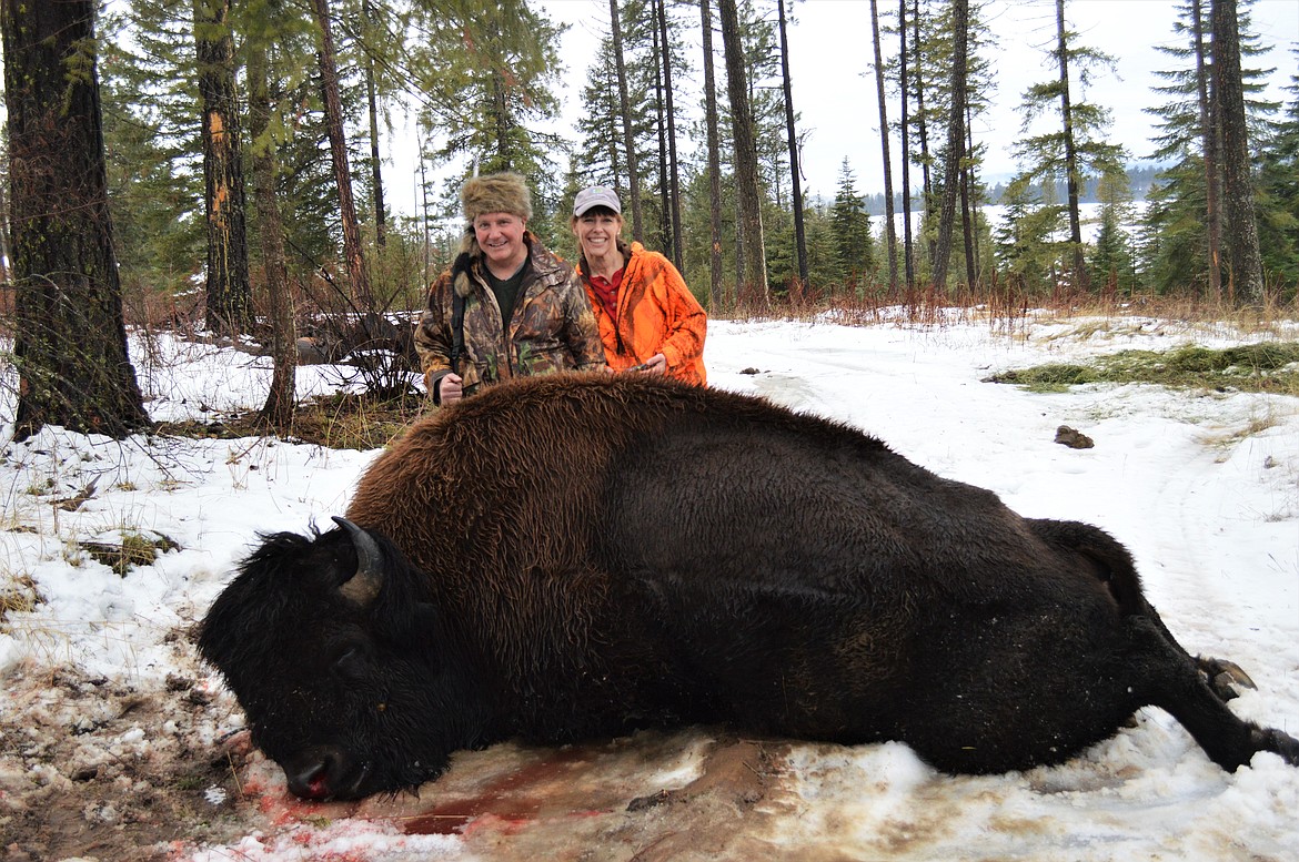 Courtesy photo
Steve Rinaldi and his wife, Ginny, pose with the buffalo he shot during his Troy Lions Club hunt. Steve sported a unique coon skin cap that he was given by his dentistry staff to wear on the hunt.