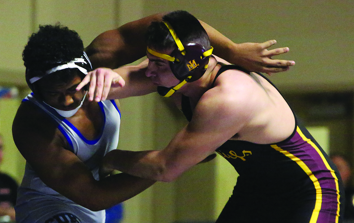 Connor Vanderweyst/Columbia Basin Herald
Moses Lake's Payton Castro (right) works against Curtis' Xavier Whitson during the 195-pound regional championship.