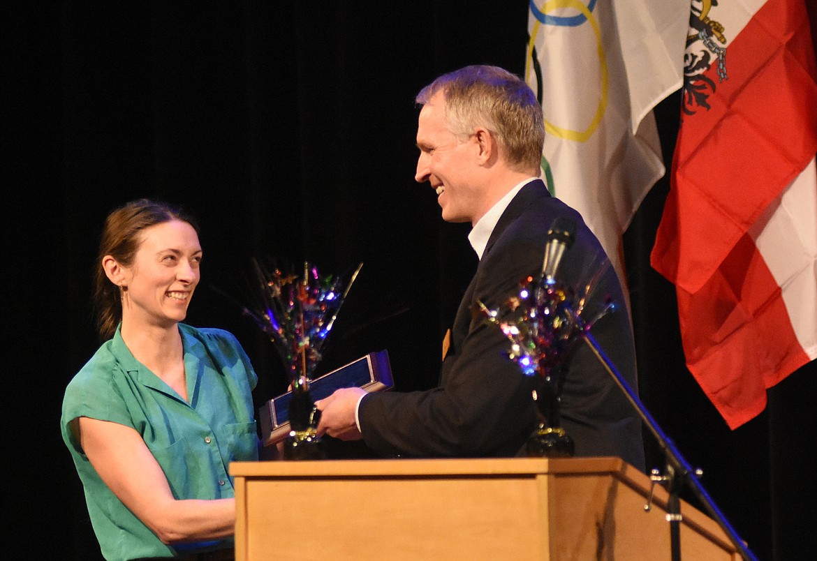 Montana Public Radio reporter Nicky Ouellet accepts the Chris Ruffatto Excellence in Education Award from Whitefish Lake Institute executive director Mike Koopal during the Whitefish Chamber of Commerce Awards Gala Feb. 7 at the O&#146;Shaughnessy Center.  (Daniel McKay/Whitefish Pilot)