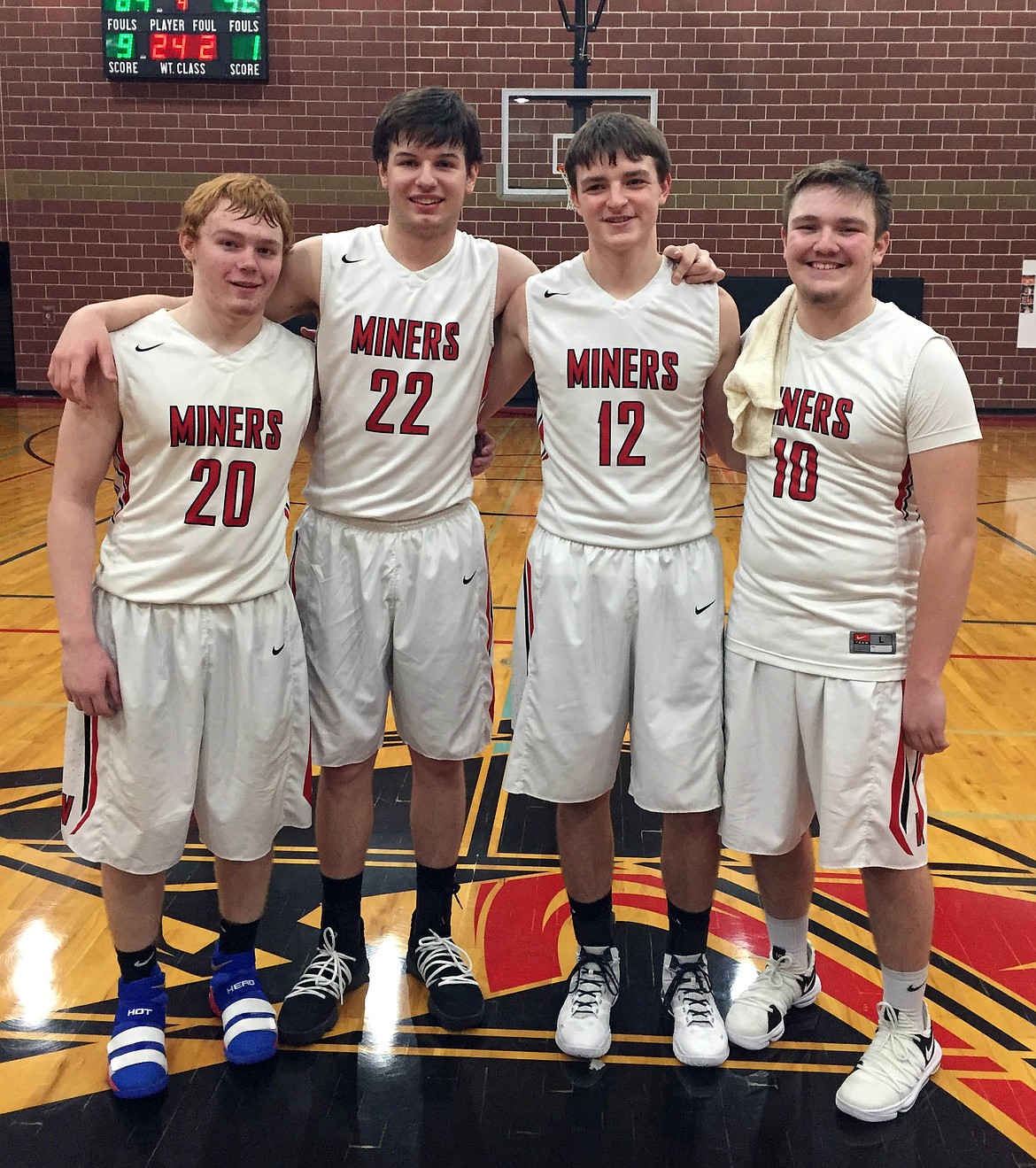 Courtesy photo
Wallace seniors Jaden Dimitroff, Hunter Gust, Matt Farkas, and Zayne Hunter stand together after knocking off Mullan on their senior night.