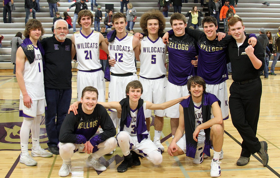 Photo by Josh McDonald 
The senior Wildcat basketball players stand with PA announcer Steve Shepperd following their senior night win over Bonners Ferry. Pictured (standing from left) are Tyler Gibbons, Steve Shepperd, Grant Nearing, Tanner Mueller, Chase Jerome, Cade Finlay, Trevor Bumgardner, and senior manager Kaen Nelson. In front are Ryan Morgan, Hogan Samuelson and Chris Jennings.