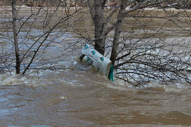 A piece of children&#146;s play equipment is forced against a tree near Enaville after it was washed away by the Coeur d&#146;Alene River. Residents in the Cataldo and Kingston area should be extra cautious when flooding season arrives.