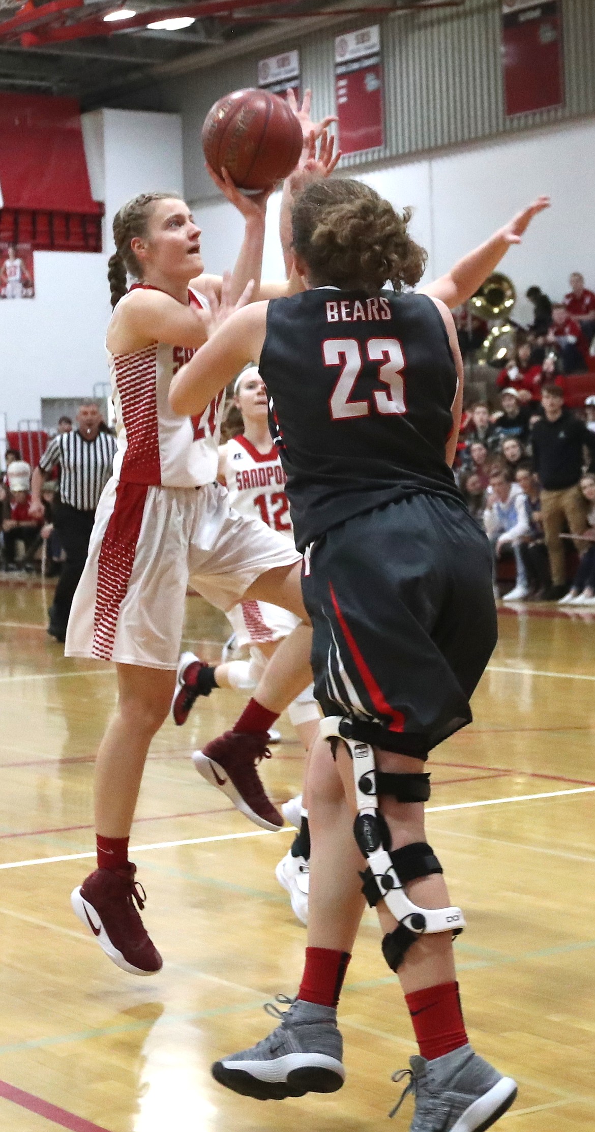 (Photo by ERIC PLUMMER)
Senior Katherine Kaul finished a fast break in the Bulldogs&#146; 21 point win the district championship.