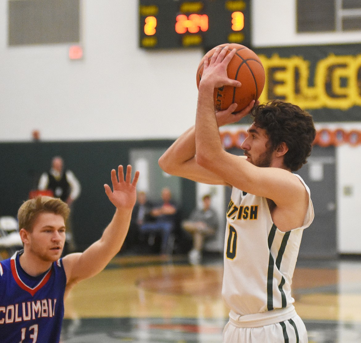 Alex Keuylian launches a quick jumper against Columbia Falls on Thursday at home.