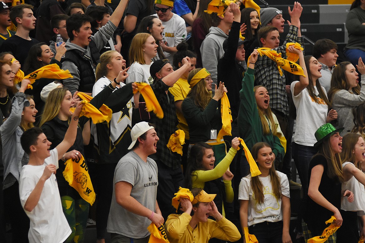 The Whitefish High School student section erupts after a late-game block by Lee Walburn in Thursday's loss to Columbia Falls at home.