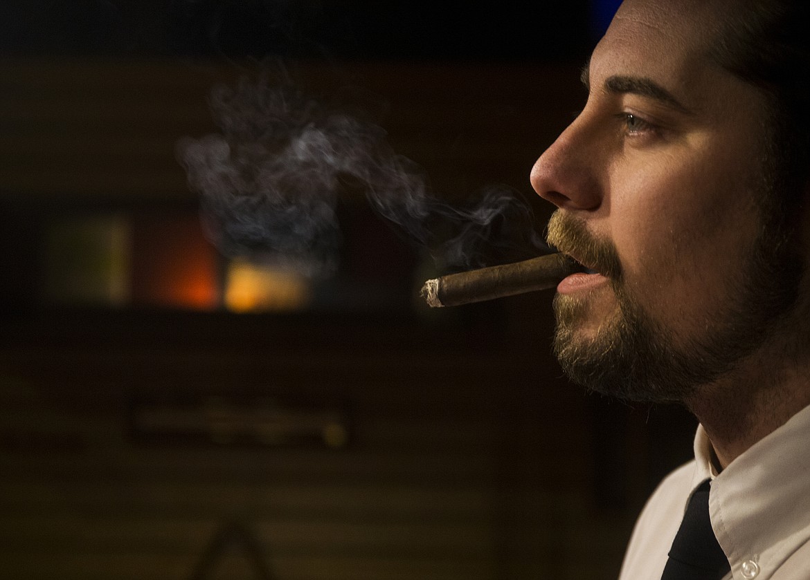 Paul Banducci, 25, took ownership of Bulldog Pipe &amp; Cigar Shop in Coeur d&#146;Alene&#146;s Silver Lake Mall twenty-one months ago. He has added an adjoining lounge where clients can enjoy a craft beer or glass of wine watching a game on the big screen and puffing their own cigar. (LOREN BENOIT/Press)