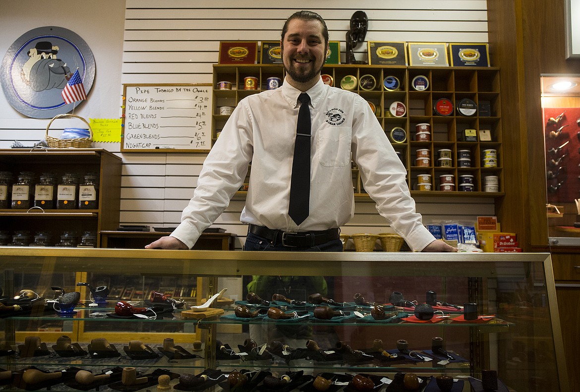 LOREN BENOIT/NIBJ
Paul Banducci, 25, owner of Bulldog Pipe &amp; Cigar Shop in Coeur d&#146;Alene&#146;s Silver Lake Mall, poses for a portrait next to various pipes at his shop.