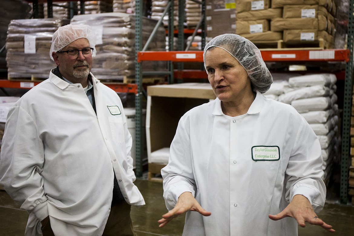 LOREN BENOIT/NIBJ
Namaste CEO Daphne Taylor, right, and Bret Taylor with Gleason Enterprises, give a tour around the 20,000-square-foot dry blending facility in Coeur d&#146;Alene.
