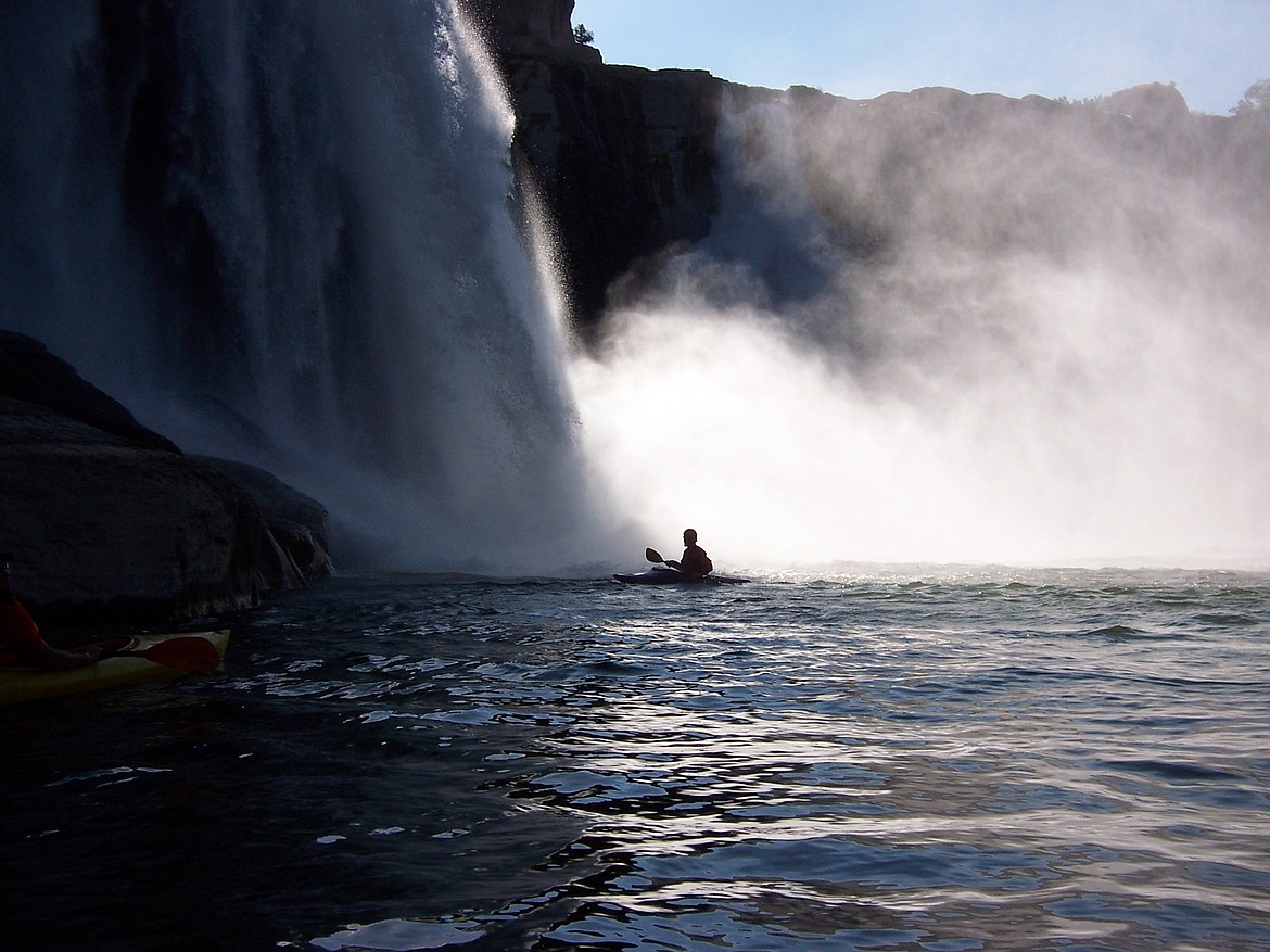 Jason Wilmoth in his kayak in the spray of Shoshone Falls.