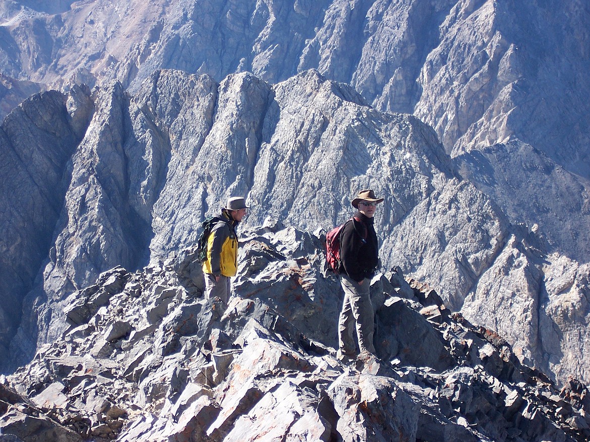 Jason Wilmoth, left, and Doug Bailey begin the hike down Mount Borah.