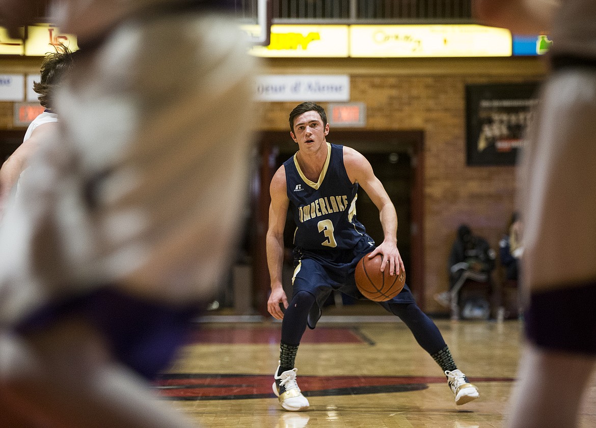 Jordan Hardy of Timberlake High surveys the Kellogg defense in the 3A District 1 championship game Wednesday night at North Idaho College.