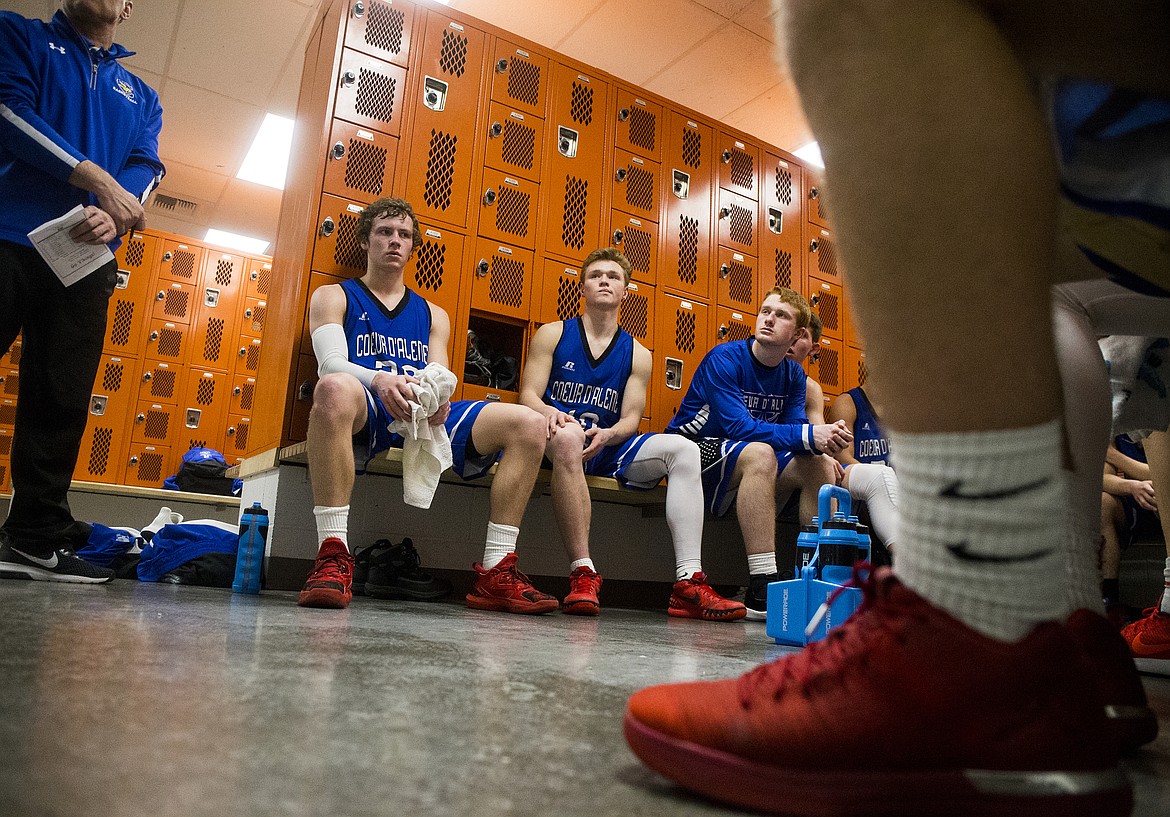 Coeur d&#146;Alene High School players listen to their coaches during halftime of the 5A Region 1 championship game against Post Falls last Tuesday at Post Falls High School.