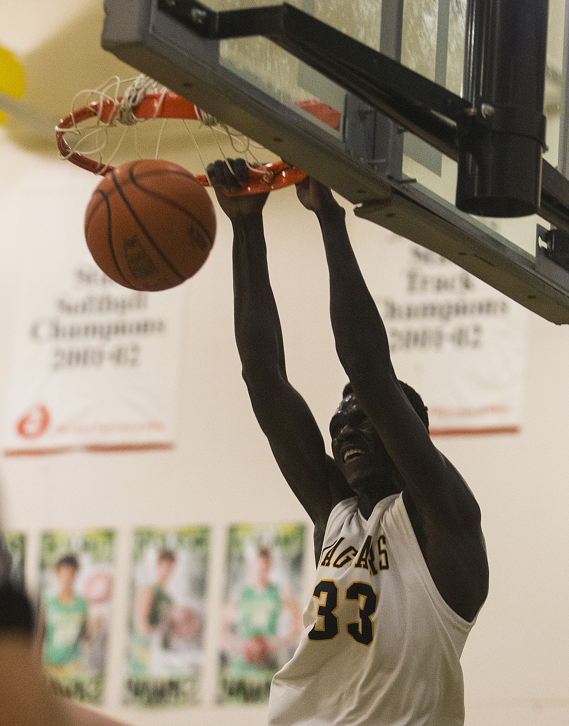 LOREN BENOIT/Press
Kon Ajang of Genesis Prep dunks against Lakeside in the 1A Division II District 1 championship game Friday at Lakeland High School.