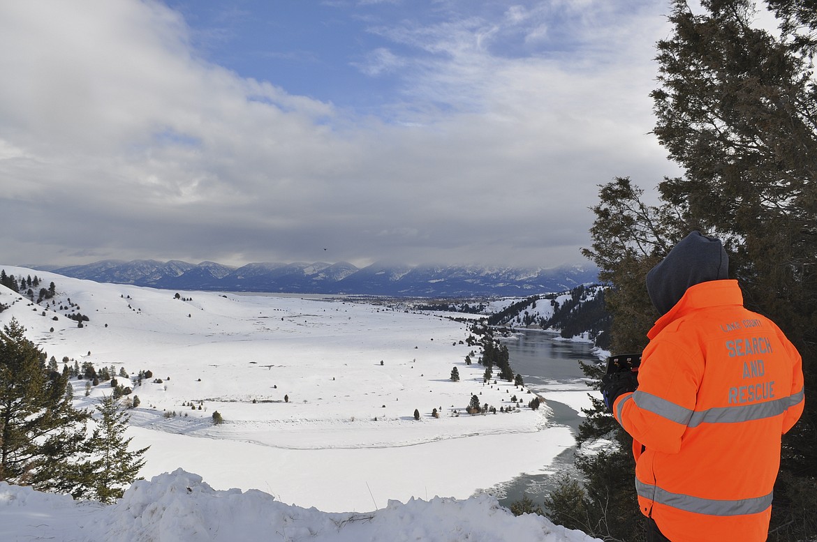 A LAKE COUNTY Search and Rescue member uses a drone Monday morning to try locating Kyle Butterhof, 26, who went missing over the weekend. Butterhof&#146;s car was found at SKQ Dam outside of Polson. Equipment was ready to be utilized by first responders. (Ashley Fox/Lake County Leader)