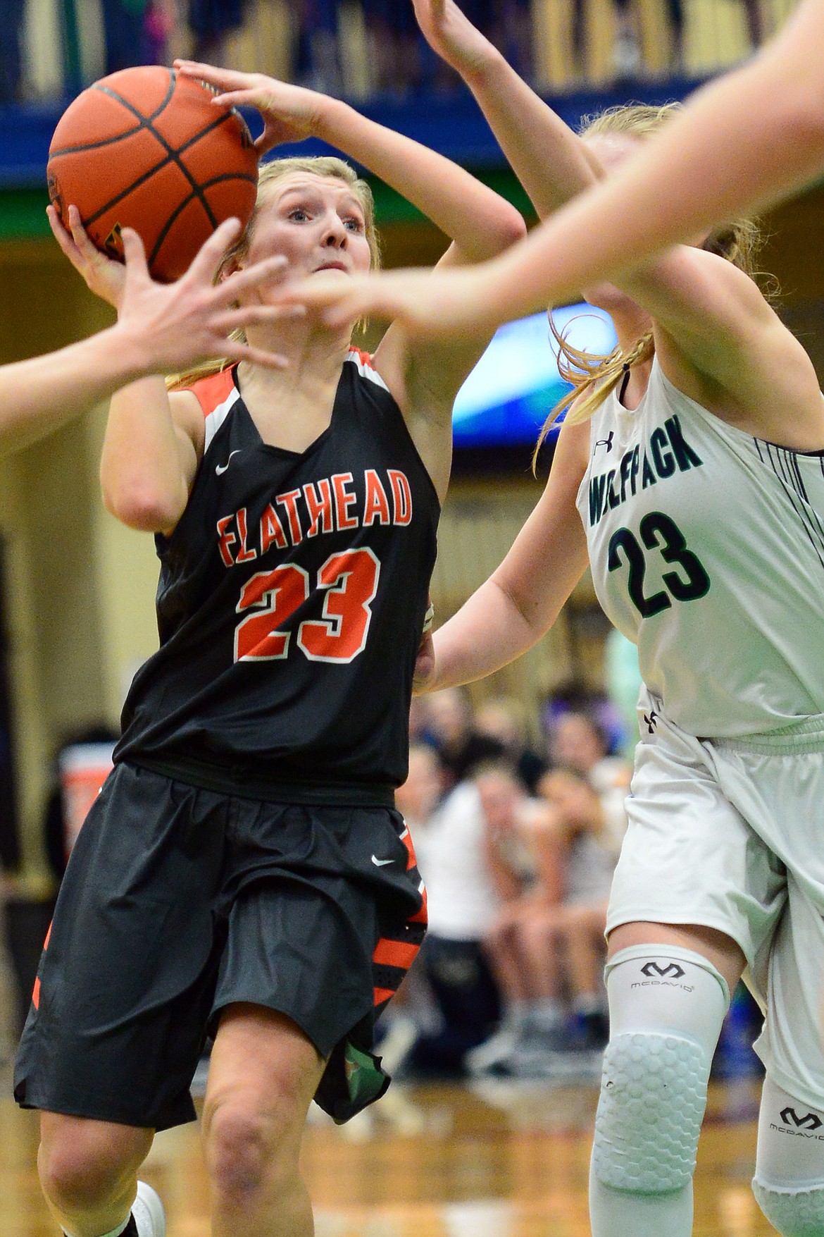 Flathead&#146;s Clara Vandenbosch looks for room to shoot with Glacier&#146;s Anna Schrade defending. (Casey Kreider/Daily Inter Lake)