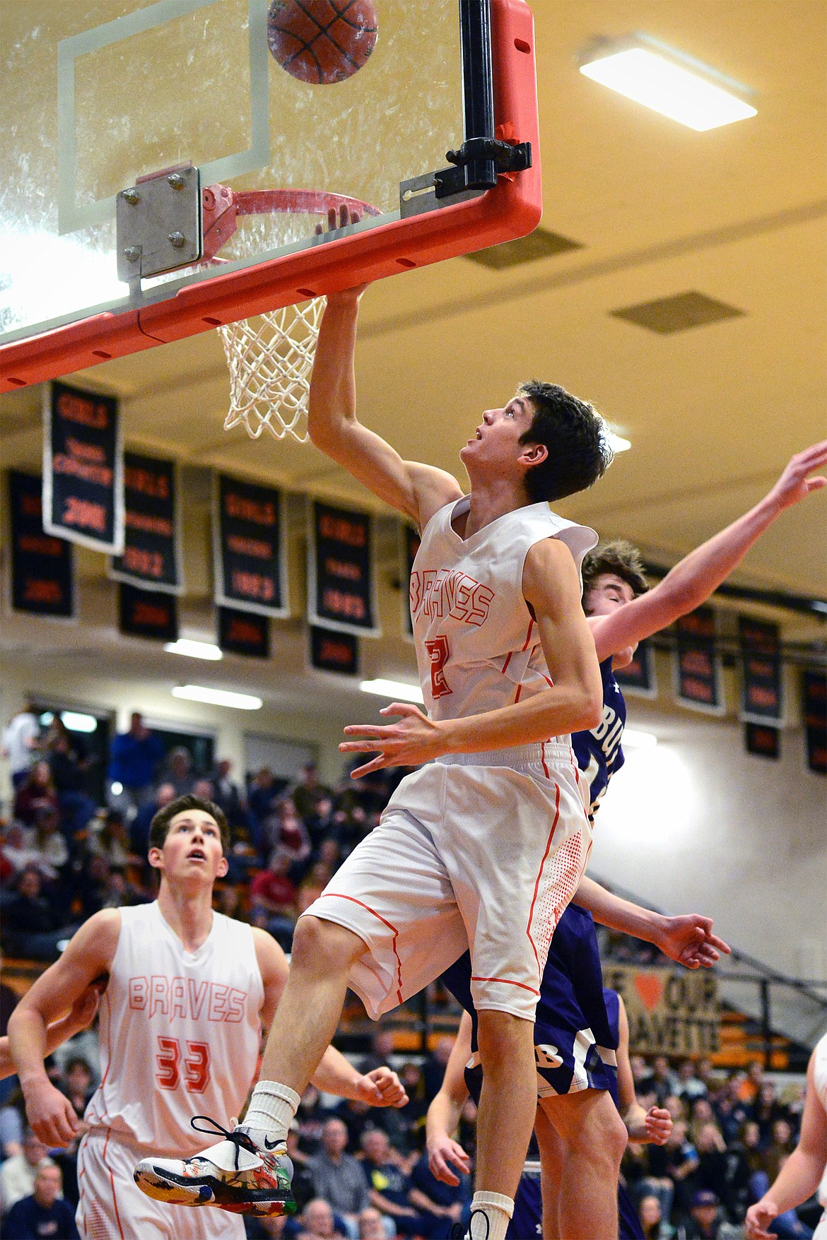 Flathead's Tyler Johnson lays in two points in the first quarter against Butte. (Casey Kreider/Daily Inter Lake)