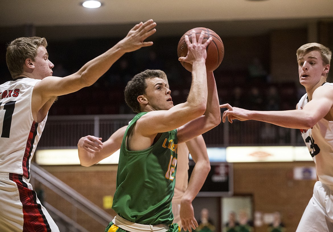 LOREN BENOIT/Press
Lakeland High&#146;s Dylan Knight drives to the basket through the Moscow defense in Game 1 of the 4A Region 1 championship series Wednesday night at North Idaho College.