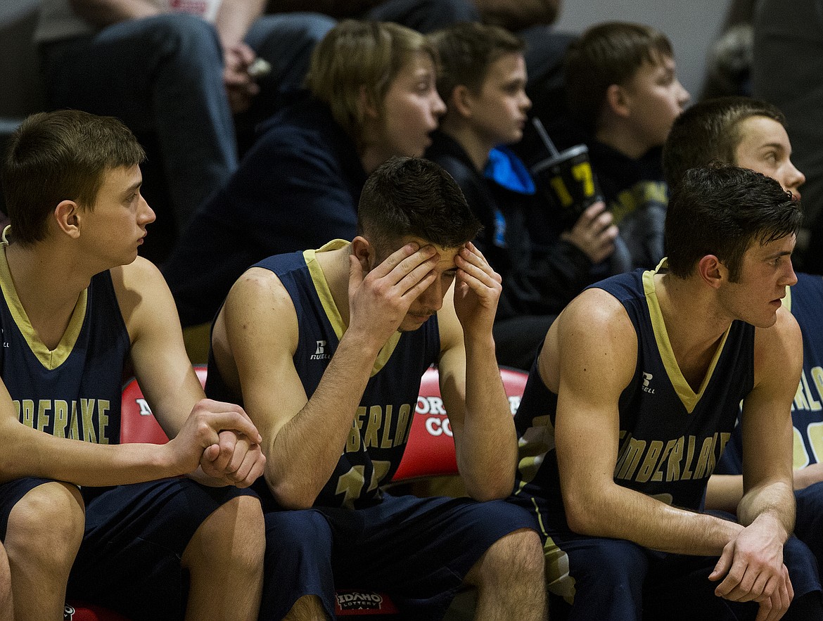 Kane Brooks, center, of Timberlake reacts to a Kellogg three-pointer in the 3A District 1 championship game Wednesday night at North Idaho College. (LOREN BENOIT/Press)