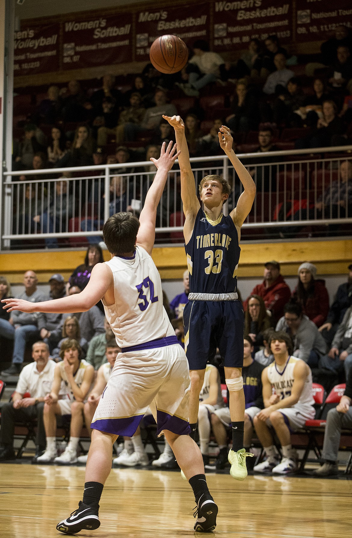 Timberlake's Chase Gardom shoots a three-pointer over Kellogg's Gavin Luna in the 3A District 1 championship game Wednesday night at North Idaho College.(LOREN BENOIT/Press)