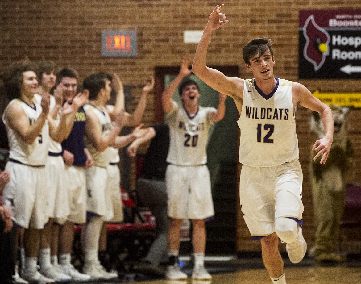 Tanner Mueller of Kellogg celebrates a three against Timberlake in the 3A District 1 championship game Wednesday night at North Idaho College. (LOREN BENOIT/Press)