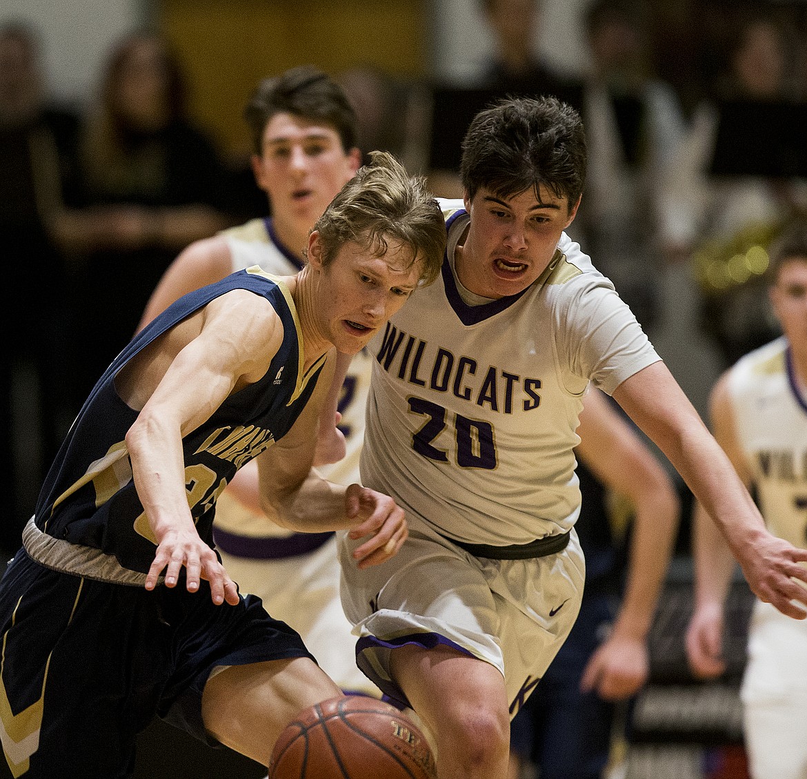 Chase Gardom of Timberlake, left,  and Trevor Bumgardner battle for a loose ball in the 3A District 1 championship game Wednesday night at North Idaho College. (LOREN BENOIT/Press)