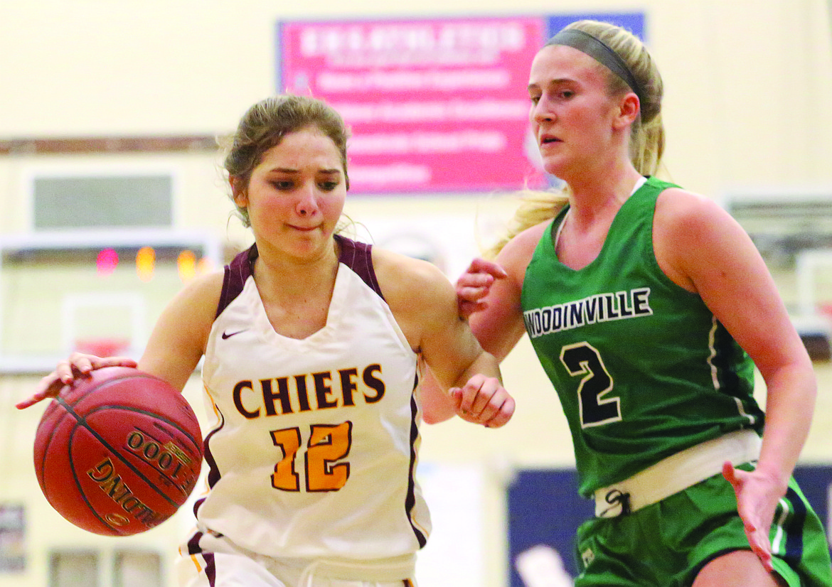 Connor Vanderweyst/Columbia Basin Herald
Moses Lake's Kiera McPartland (12) tries to find some space against Woodinville's Nikki Zaback.