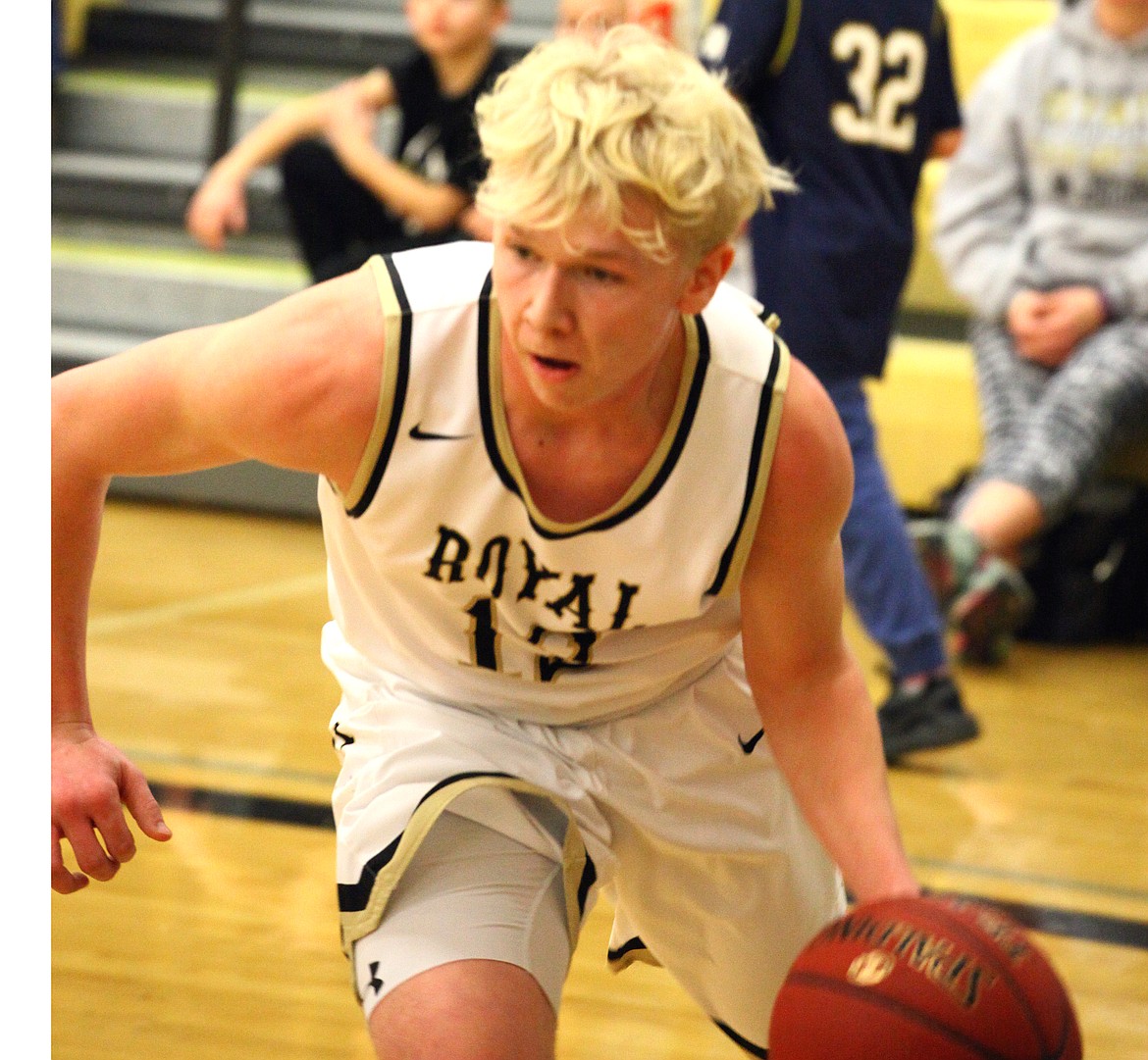 Rodney Harwood/Columbia Basin HeraldRoyal guard Gage Christensen (12) and the Knights have one more game against Bellevue Christian before heading to the Yakima SunDome.