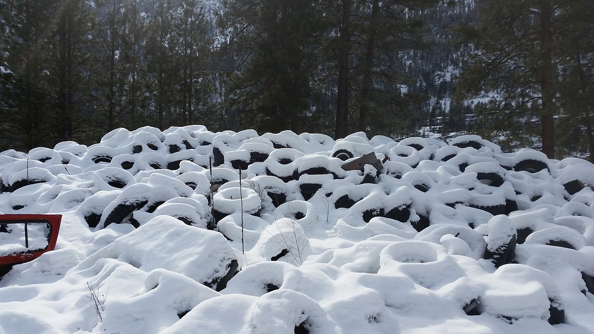 A new definition for &#147;snow tires&#148; can be found at the dump west of Alberton, where hundreds of them have been covered with a fresh blanket of snow. (Kathleen Woodford/Mineral Independent)