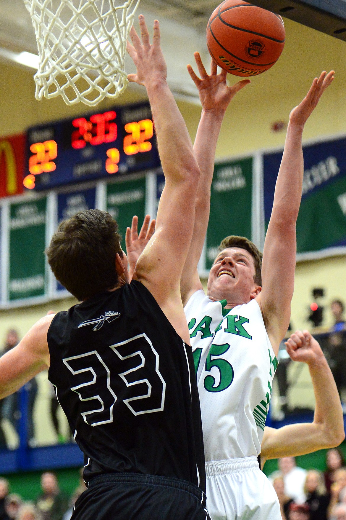 Glacier&#146;s Drew Engellant looks to shoot with Flathead&#146;s Sam Elliott defending during a 59-56 crosstown victory for the Braves Thursday night at Glacier High School. (Casey Kreider/Daily Inter Lake)