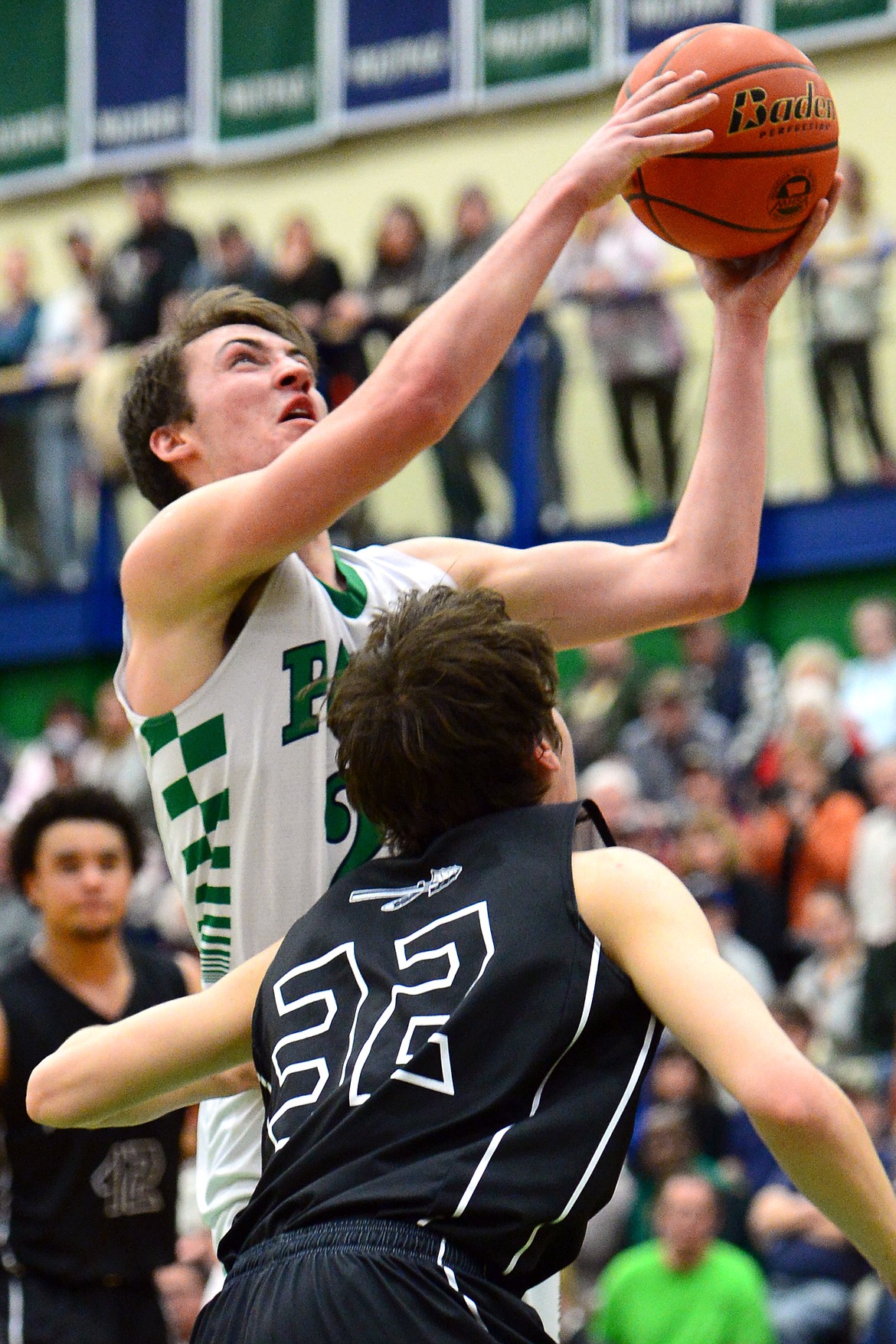 Glacier&#146;s Nick Whitman drives to the hoop against Flathead&#146;s Tyler Johnson during a 59-56 crosstown victory for the Braves Thursday night at Glacier High School. (Casey Kreider/Daily Inter Lake)