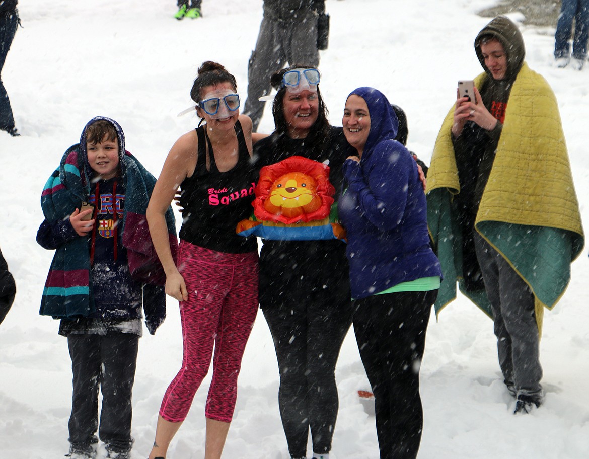 (Photo by MARY MALONE)A group of Polar Plungers pose for a photo after taking part in Saturday's event. More than 30 people braved the elements Saturday as the Priest River Panthers hosted their annual Polar Plunge at Bonner Park West. The event is a fundraiser for the Panthers Special Olympics team.