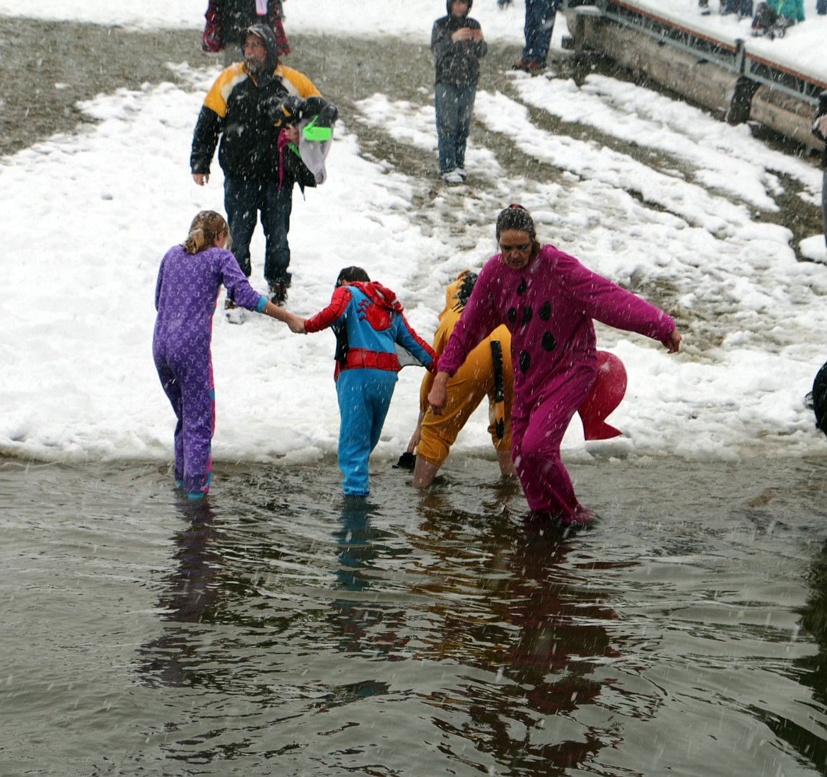 (Photo by MARY MALONE)Several Polar Plungers make their way into and out of the water as more than 30 people braved the elements Saturday as the Priest River Panthers hosted their annual Polar Plunge at Bonner Park West. The event is a fundraiser for the Panthers Special Olympics team.