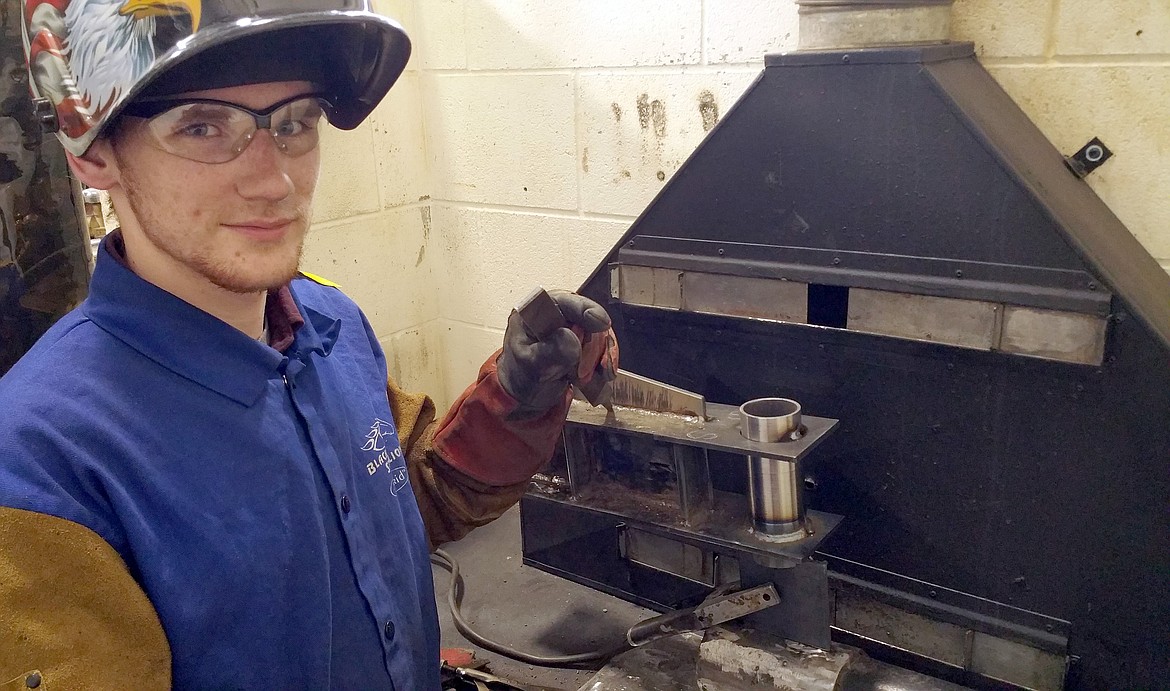 Libby High School student Jonathan White poses with the piece he had to weld in place for the FVCC Welding Competition on Feb. 22. (Courtesy photo)