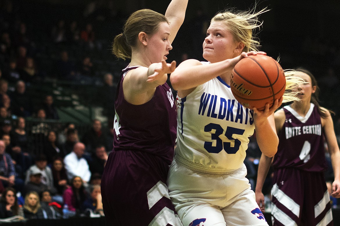 Columbia Falls junior Trista Cowan takes the ball up against Butte Central defender Kailee Murphy at the Western A Divisional Tournament in Butte Thursday. (Jeremy Weber photo)