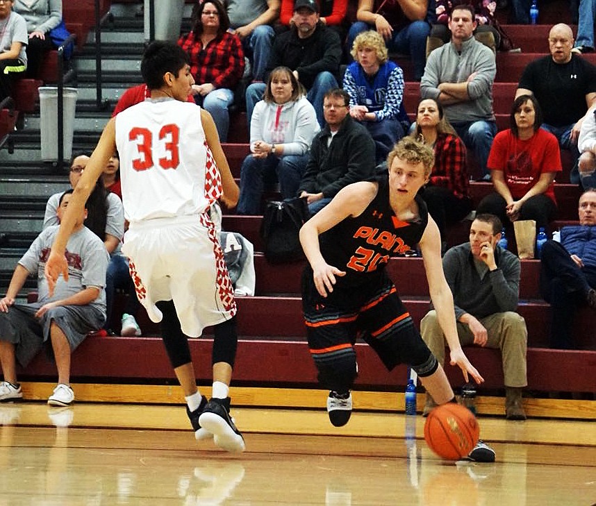 Wyatt Weyers (20) gets past Warrior Isaac Fisher in the championship game. (Erika Lawyer/ PHS Booster Club)