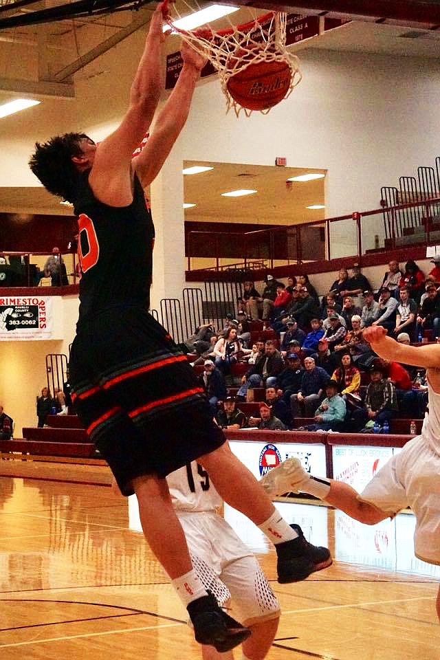 Jay Vonheeder slam dunks in the semifinals for the Horsemen. (Erika Lawyer/ PHS Booster Club)