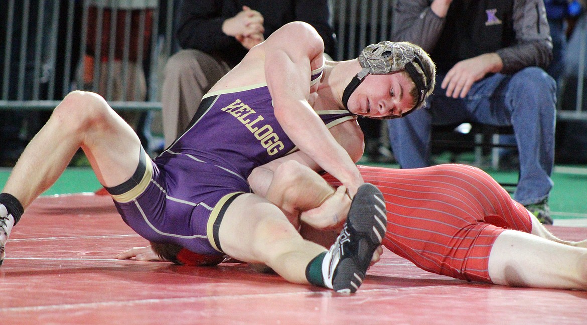 Kellogg wrestler Judson Hall controls his opponent&#146;s arm.