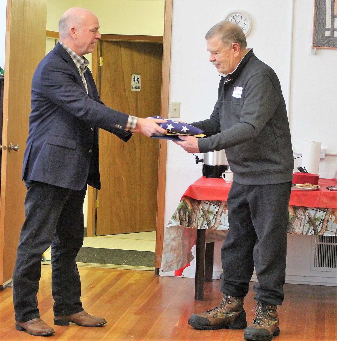 U.S. Rep. Greg Gianforte presents Bruce Charles with the Montana Congressional Veteran Commendation on Saturday, Feb. 17, at the Old Schoolhouse in De Borgia. (Kathleen Woodford/Mineral Independent)