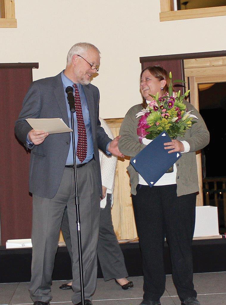 Rhonda Flemmer is awarded the Clark Fork Valley Hospital employee of the year for 2017. Dr. Hanson is also pictured as he awards the honor to Flemmer. (Photo supplied)