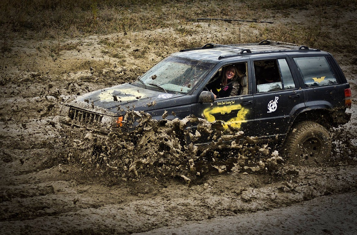 Courtesy Photo
Batgirl making mud fly, and her smile shows how much fun she is having.