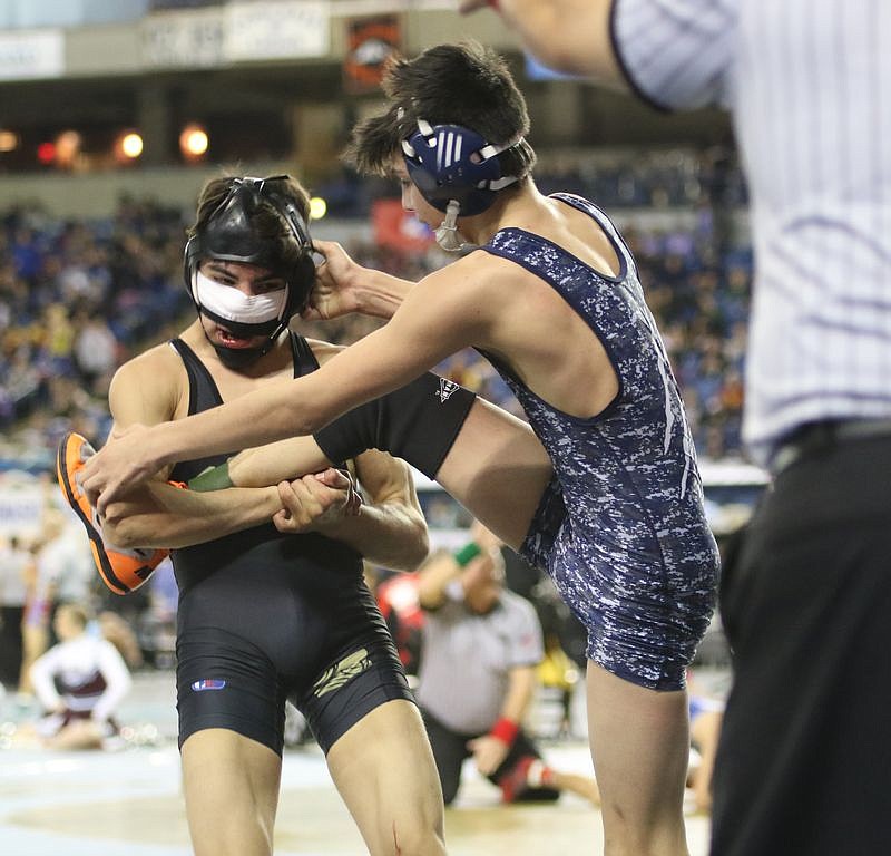 Bob Kirkpatrick/The Sun Tribune - The Knight's Dominic Martinez lost a lot of blood during his match with Chewlah's Justyce Acosta.