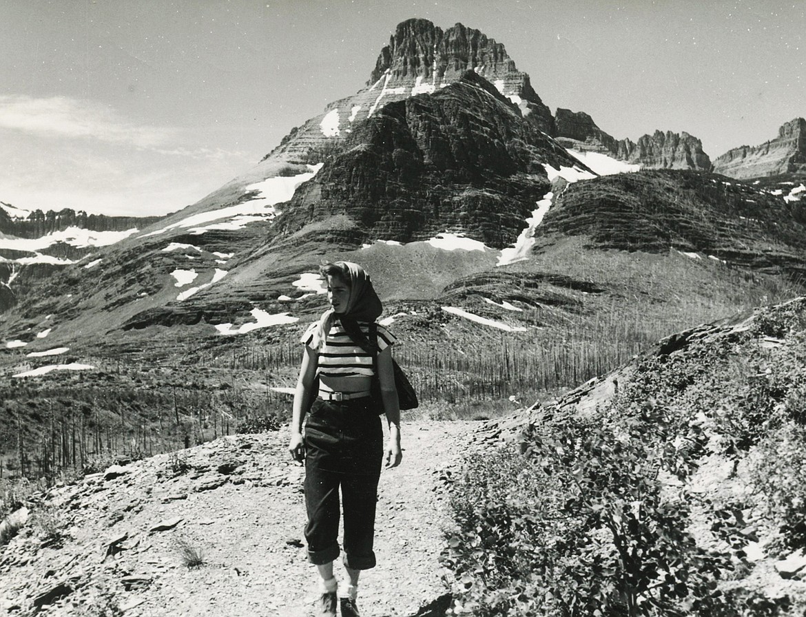 Young Sheila Lacy (Morrison) walks along a trail in Glacier National Park in the 1950s.