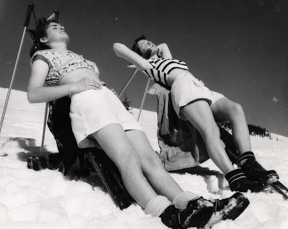 Sheila Lacy (Morrison) and Lillian Luzon sunbathe on Big Mountain in the 1950s.