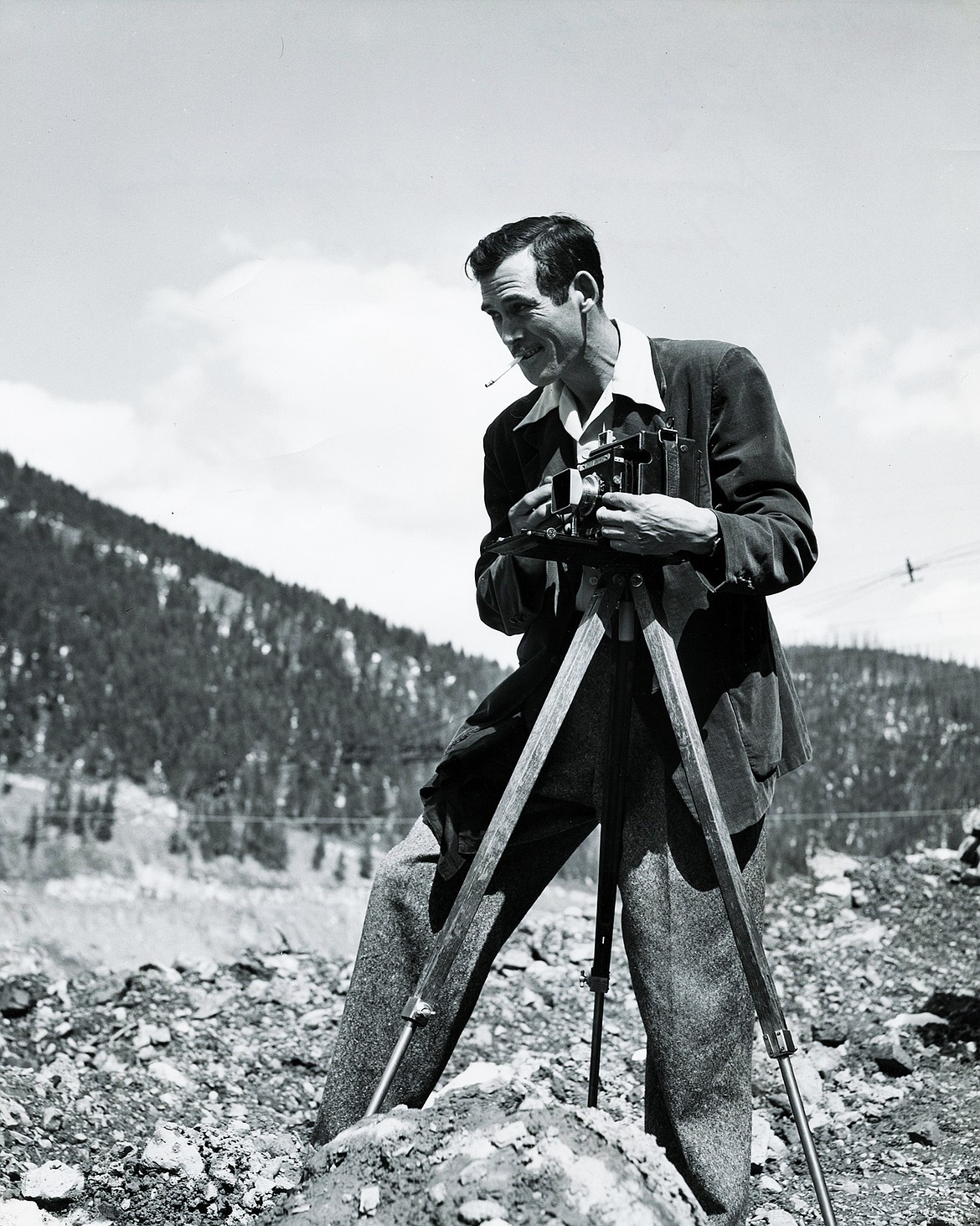 Marion Lacy sets up his camera at the Hungry Horse Dam in 1951.