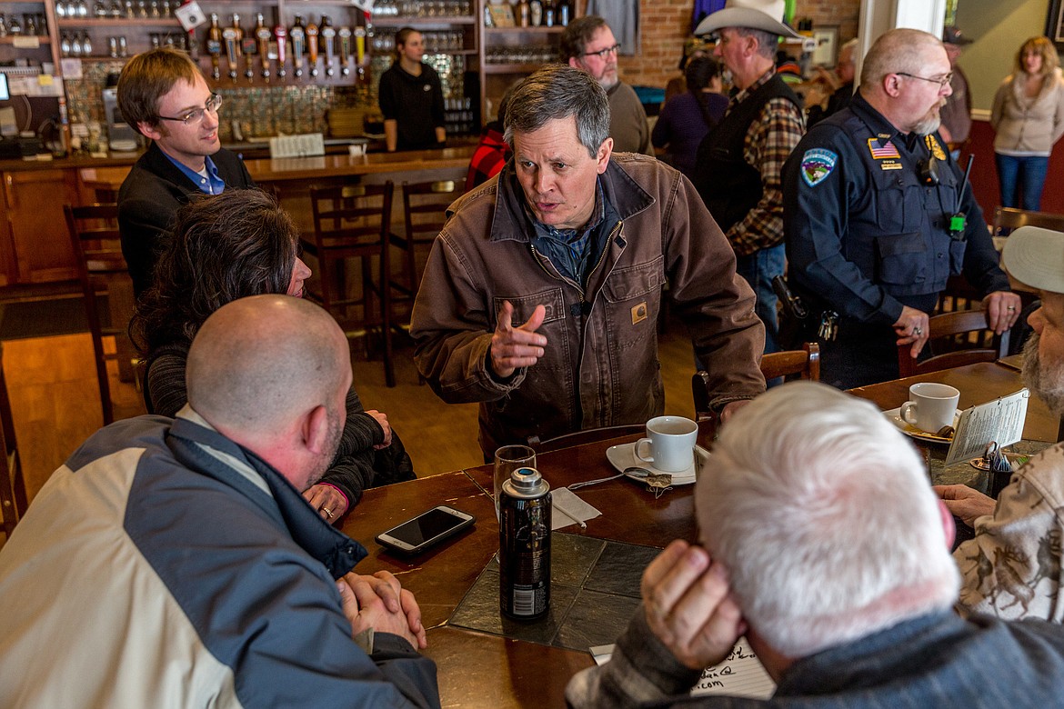 Sen. Steve Daines, center, speaks with local elected officials, community leaders and constituents at Cabinet Mountain Brewing Company in Libby Tuesday. Daines was on day one of a four-day tour of northwest Montana to discuss passage of the Tax Cuts and Jobs Act. (John Blodgett/The Western News)