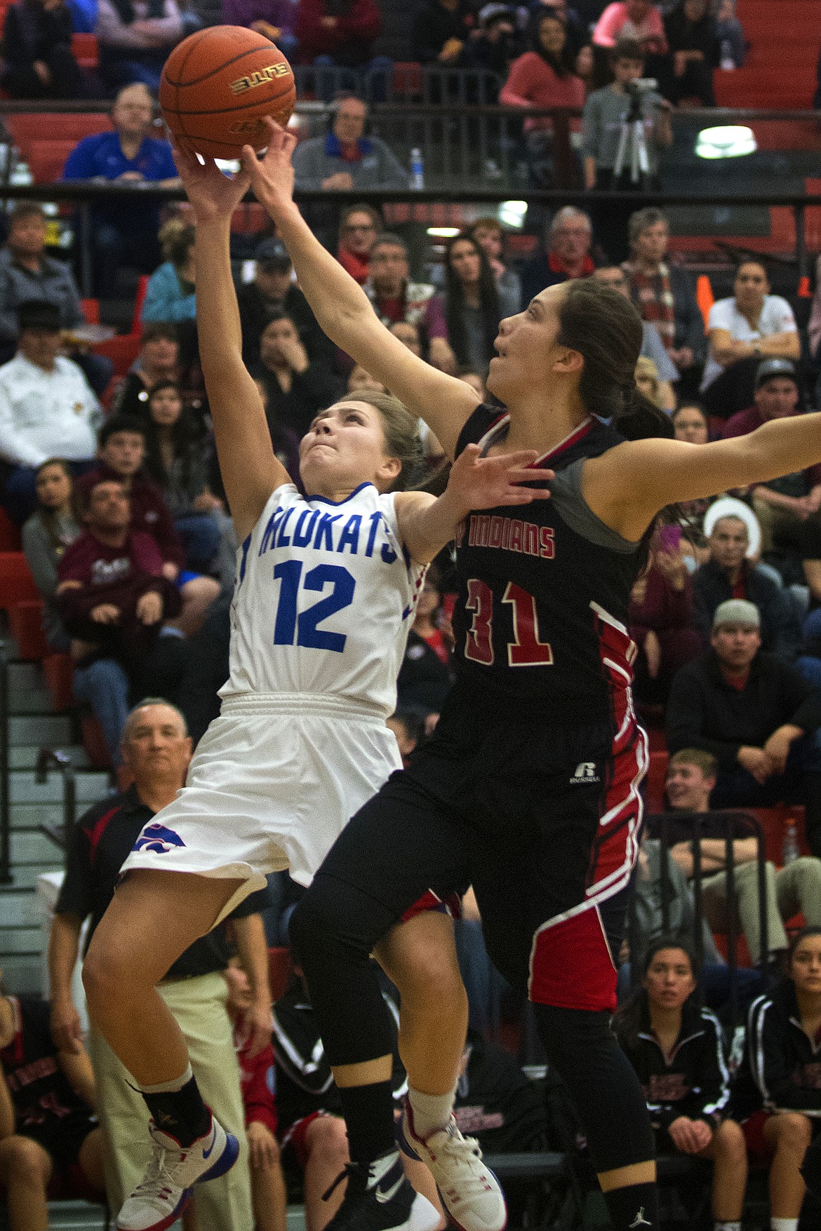 LaKia Hill goes up for a shot against Browning defender Ronnal Jordan in the district championship game in Ronan Saturday. (Jeremy Weber photo)