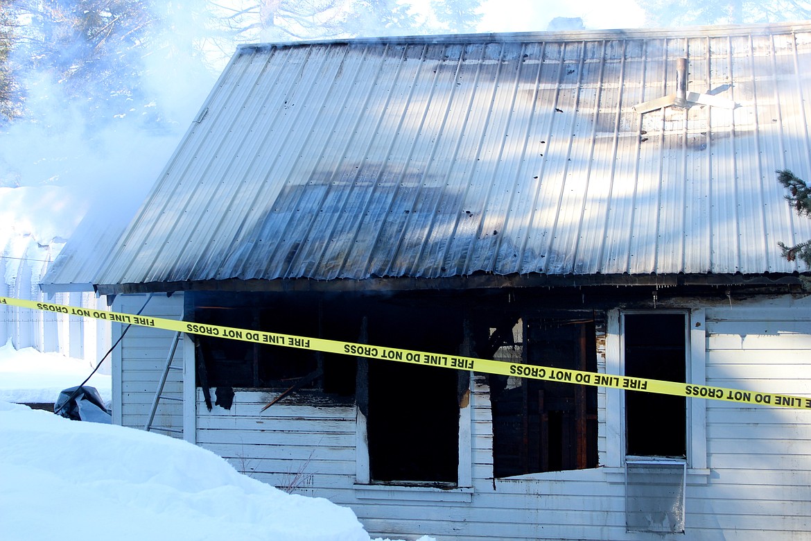 Photo by CHANSE WATSON
Burnt out windows on the southeast side of the home show that the fire spread throughout the entire structure.